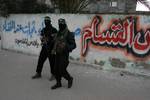 Palestinian Hamas militants patrol in the streets during the celebrations marking the Islamist movement's 24th founding anniversary, in the Rafah refugee camp in the southern Gaza Strip on December 19, 2011.Photo by Ahmed Deeb/wn