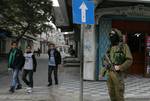 Palestinian Hamas militants patrol in the streets during the celebrations marking the Islamist movement's 24th founding anniversary, in the Rafah refugee camp in the southern Gaza Strip on December 19, 2011.Photo by Ahmed Deeb/wn