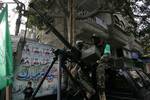 Palestinian Hamas militants patrol in the streets during the celebrations marking the Islamist movement's 24th founding anniversary, in the Rafah refugee camp in the southern Gaza Strip on December 19, 2011.Photo by Ahmed Deeb/wn