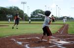 Miami Marlins outfielder Bryan Petersen pitches during a children's softball game and baseball clinic at the Pacific Missile Range Facility in Kekaha, Hawaii, as part of an armed forces entertainment tour.