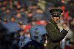 Col. Jay Kennedy, director of Humanities & Social Science at the U.S. Naval Academy, directs pre-game warm ups.