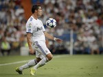 Real Madrid's Cristiano Ronaldo from Portugal controls the ball during his Santiago Bernabeu Trophy final soccer match against Penarol in the Bernabeu stadium in Madrid, Tuesday, Aug. 24, 2010.