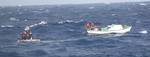 MIAMI - The crew of the Coast Guard Cutter Vigorous, homeported in Cape May, N.J., rescues three fishermen in distress 32 miles east of Key West, Fla., Nov. 2, 2011. The three survivors were transferred to members of the Cuban Border Guard in international waters. U.S. Coast Guard photo. (1482567) ( Coast Guard Cutter Vigourous 55 day patrol )