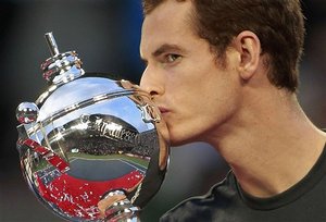 Andy Murray of Britain kisses his trophy he won after beating Rafael Nadal of Spain in their final match at the Japan Open tennis tournament in Tokyo, Japan, Sunday, Oct. 9, 2011.