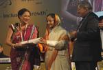 The President, Smt. Pratibha Devisingh Patil presenting the Pravasi Bharatiya Samman Award to the Prime Minister of the Republic of Trinidad and Tobago, Mrs. Kamla Persad-Bissessar, at the valedictory session of tenth Pravasi Bharatiya divas 2012, at Jaipur, Rajasthan on January 09, 2012. The Union Minister for Overseas Indian Affairs, Shri Vayalar Ravi is also seen.