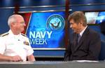 Deputy Vice Cmdr., Naval Air Systems Command, Rear Adm. Richard J. Wallace, talks with Mr. Bill Murphy, host for Fox News 13 Good Day Tampa Bay morning show about Tampa Navy Week.