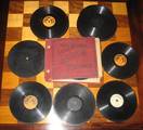 A selection of gramophone records and an album