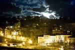 A view of The Strand in the old town of Rondout at night under a full moon