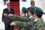 Greek Defense Minister Dimitris Avramopoulos, right, and his Israeli counterpart Ehud Barak review a special forces military honor guard at the Defense Ministry in Athens, Tuesday, Jan. 10, 2012.