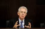 Italian Premier Mario Monti briefs the media in Rome, Sunday, Dec. 4, 2011.