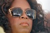 Oprah Winfrey looks out over the audience as she listen to a speaker in Whitesboro, N.J. Satuday, Aug. 30, 2008. Winfrey is scheduled to be the keynote speaker Saturday at the annual festival in Whitesboro, a tiny, rural community founded in 1901 as a settlement for blacks leaving the S