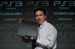 Sony Computer Entertainment Japan President Shawn Layden shows off a new PlayStation 3 during a news conference in Tokyo, Japan, Wednesday, Aug. 19, 2009.