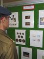 An Army personnel looking at the golden stamps of Princess Diana at the Philatelic exhibition held in Kolkata in Eastern India City