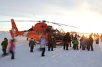 NOME, Alaska Nome residents, young and old, seize an opportunity to get a closer look at a Coast Guard MH-65 Dolphin helicopter Jan. 18, 2012. The crew of the Dolphin landed the aircraft on a beach near the city during a community event. U.S. Coast Guard photo by Petty Officer 3rd Class Grant DeVuyst. (1501153) ( MH65 NOME )