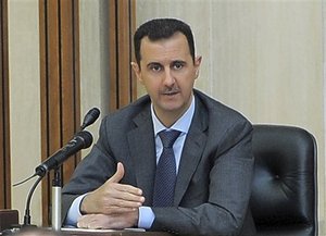 In this photo taken Wednesday, Aug. 17, 2011, released by the Syrian official news agency SANA, Syrian President Bashar Assad addresses a meeting for the central committee of the Baath party in Damascus, Syria.