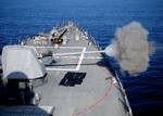 The MK-45 5-inch/54-caliber lightweight gun aboard the guided-missile destroyer USS Halsey (DDG 97) fires