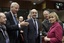 French Foreign Minister Alain Juppe , center, speaks with Sweden's Foreign Minister Carl Bildt, second left, and Croatian Foreign Minister Vesna Pusic, right, during a meeting of EU foreign ministers at the EU Council building in Brussels on Monday, Jan. 23, 2012.