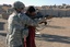 File - U.S. Army Staff Sgt. David Heath, of the 56th Military Police Company, 101st Airborne Division, teaches basic rifle marksmanship with Iraqi Police Trainees at Forward Operating Base Danger,Iraq on Jan. 8, 2008.