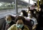 FILE - In this Thursday, May 1, 2003 file photo, passengers wearing masks sit in a bus in Hong Kong to protect themselves from severe acute respiratory syndrome, or SARS, that has killed at least 162 people in Hong Kong. The scenes now unfolding in Mexico City are familiar ones to this region. Years before the swine flu outbreak, Asia dealt with two major public health emergencies back-to-back, SARS and bird flu. Both crises offered lessons that have helped China , Vietnam and other countries in the region prepare for the emergence of the latest global epidemic, experts and officials say.