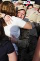 TAMPA, Fla. - A Clearwater, Fla., based Port Security Unit 307 member embraces her loved one after returning home from an extended deployment to the Middle East, Jan. 23, 2012. While deployed, PSU 307 members provided harbor defense and security to ports, seaward approaches, and waterways within U.S. Central Command's area of responsibility and ensuring the free flow of personnel, equipment and commerce in the region. U.S. Coast Guard photo by Petty Officer 3rd Class Tara Molle (1504366) ( PSU 3