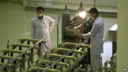 Technicians work at a facility in Iran to produce uranium fuel for a planned heavy-water nuclear reactor, just outside the city of Isfahan.