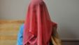 A veiled Kyrgyz bride sits for a photograph. Up to three-quarters of contemporary Kyrgyz brides are betrothed through "bride kidnapping" rituals. Now the Kyrgyz parliament is considering legislation that may chip away at the practice.