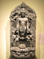 12th century stone sculpture of God Vishnu flanked by two apsaras one with a fan(left) and the other with Tambura(right).