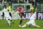 Juventus captain Alessandro Del Piero, center, scores a goal during the Italian Cup eight final soccer match between Juventus and AS Roma, in Turin, Italy, Tuesday, Jan. 24, 2012.