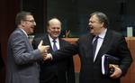 Greek Finance Minister Evangelos Venizelos, right, speaks with Belgium's Finance Minister Steven Vanackere, left, and Irish Finance Minister Michael Noonan, center, during a meeting of EU finance ministers in Brussels on Monday, Jan. 23, 2012.