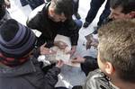 Bosnian veteran soldiers are collecting money for their war-time enemies in Gorazde, 100 kms. east from Sarajevo, Monday, Jan. 16, 2012.