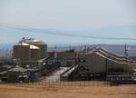 Cogeneration plant, which burns gas from the field to produce steam for enhanced recovery, and also provides electricity for California's power grid.