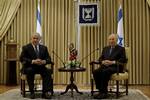 Israel's President Shimon Peres, right, sits with Likud Party leader Benjamin Netanyahu during their meeting at the President's residence in Jerusalem Friday, Feb.20, 2009. Netanyahu of the hawkish Likud Party has received formal permission from Israel's ceremonial president to put together the country's next government. At a ceremony at President Shimon Peres' residence, Netanyahu urged Foreign Minister Tzipi Livni of the governing Kadima Party and Defense Minister Ehud Barak of the Labor Party