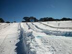 A toboggan field,Perisher, Australia. A toboggan is a simple sled which is a traditional form of transport used by the Innu and Cree of northern Canada