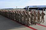 TAMPA, Fla. - Clearwater, Fla., based Port Security Unit 307 members stand in formation during a homecoming ceremony after returning home from an extended deployment to the Middle East, Jan. 23, 2012. While deployed, PSU 307 members provided harbor defense and security to ports, seaward approaches, and waterways within U.S. Central Command's area of responsibility and ensuring the free flow of personnel, equipment and commerce in the region. U.S. Coast Guard photo by Petty Officer 3rd Class Tara