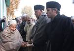 A kashmiri muslim man greets Jammu and kashmir Chief Minister Omar Abdullah with his father Dr, Farooq Abdullah and Union Renewable Minister offer Eid al-Adha prayers during the second biggest religious festival of Muslims November 07, 2011 at Hazratbal Shrine Srinagar, the summer capital of Indian administered Kashmir, India. Muslims around the world are celebrating Eid al-Adha by slaughtering camels, sheep, goats and cows to commemorate Prophet Abraham?s willingness to sacrifice his son, Ismai