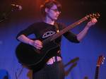 Kaki King in concert.Playing at The Knitting Factory Los Angeles; January 2005.As a long-time Ovation player, King was invited to design her own custom guitar, the result being the Adamas 1581-KK model.