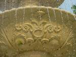 The 28 feet (9 m) high Italian limestone fountain in Harrison Plaza bears design elements patterned after the limestone art deco accents on Bibb Graves Hall.