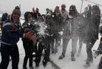 Tourists enjoy on banks of World Famous Dal Lake during a snowfall in Srinagar, the summer capital of Indian Kashmir on 15, January 2012.