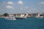 The waterfront of Zanzibar city.Covering an area of 2,461 km2 (950 sq miles)[17] Zanzibar is a mainly low lying island, with its highest point at 120 meters.[18] It is 108 km long and 32.km wide.