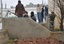 Syrian army defectors secure an area near an anti-Syrian regime protest in the Deir Baghlaba area of Homs province, central Syria, on Friday, Jan. 27, 2012.