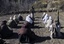 In this Sunday, Dec. 11, 2011 photo, masked Pakistani Taliban militants take part in a training session in an area of Pakistan's tribal South Waziristan region along the Afghan border.