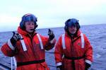 JUNEAU, Alaska (Jan. 30, 2003)--Petty Officers Scott Jones (left) and Frank Nicasio of Air Station Kodiak send hand signals to the flight crew on board a HH-65 Dolphin helicopter to make sure everything is okay for take-off, off of the Coast Guard cutter Jarvis in the Bering Sea Jan. 30, 2003. USCG photo by PA3 Russ Tippetts (87089) ( BERING SEA PATROL (FOR RELEASE) )