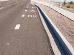 A street pavement markings tell bicyclists in the bike lane that it is okay for them to enter the sidewalk in the United States