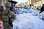 A coalition soldier secures an area during a dismounted patrol in Muqer district, Ghazni province, Afghanistan, Jan. 29, 2012.