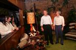 President George W. Bush and Japanese Prime Minister Junichiro Koizumi share a laugh in the Jungle Room while Laura Bush, Priscilla Presley and daughter Lisa-Marie Presley look on, Friday, June 30, 2006, in Memphis, Tennessee, during a tour of Graceland,