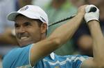 Europe's Padraig Harrington tees off on the 13th hole during their foursome match at the Ryder Cup