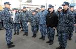 Capt. Paul Skarpness, commander of Submarine Squadron (SUBRON) 17, congratulates the Blue and Gold crews of the ballistic-missile submarine USS Nebraska (SSBN 739).