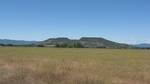 Upper Table Rock from the Denman Wildlife Area. Two caves and two former gold mines are located at the base of the andesite cap on Upper Table Rock.