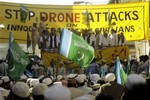 Supporters of Pakistani religious party Jamat-i-Islami listen to their leaders during a rally to condemn U.S. drone attacks on alleged militants and Talibans hideouts in Pakistani border areas along Afghanistan, in Peshawar, Pakistan on Friday, April 24, 2009.