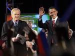 In this April 2, 2008 file photo, then Democratic presidential hopeful, Sen. Barack Obama D-Ill., right, waves to the crowd with 